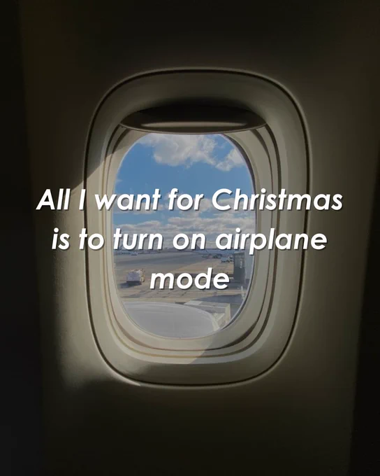 View through an airplane window showing clouds and sky, overlaid with the text "All I want for Christmas is to turn on airplane mode."