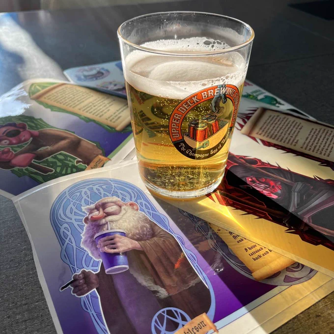 a beautifully lit image of a pint glass and prayer candle-style sticker decals - pint glass designed by Steve Dressler & candle decals designed by Steve Argyle 