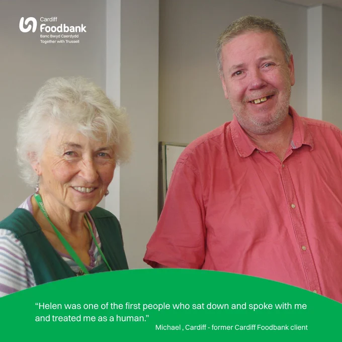 Photo of Cardif Foodbank Lead Volunteer Helen with past client Michael and words  "Helen was one of the first people who sat down and spoke with me and treated me as human." 