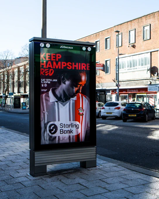 An image of Southampton FC Women's "Keep Hampshire Red" advert featuring Atlanta Primus on an electronic advertising board in Southampton's London Road