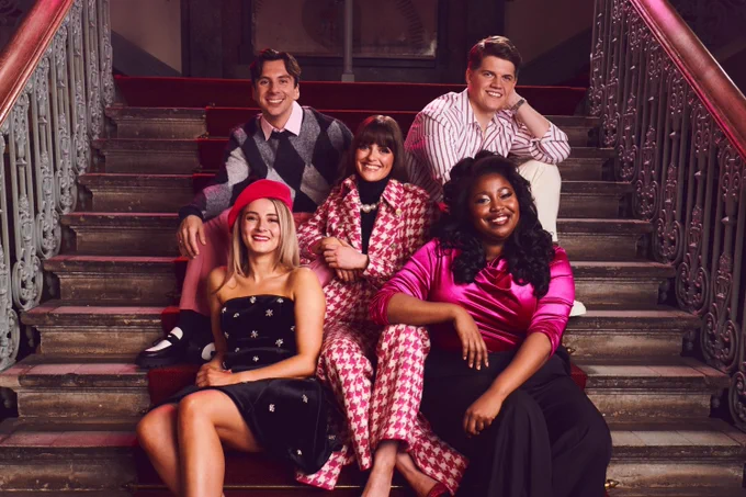 The cast of Legally Blonde smile on stairs