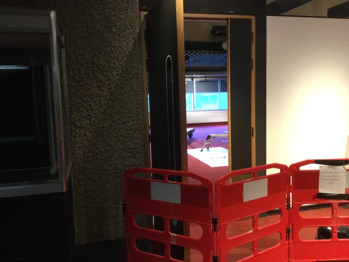 a photo of a door opening to the new community room at the barbican library