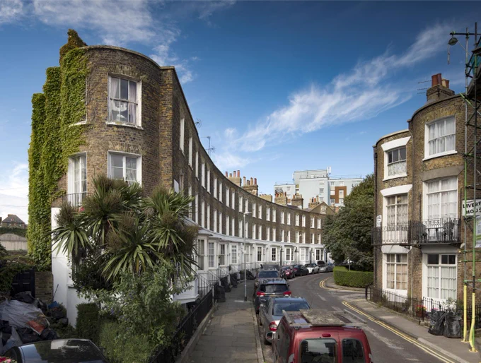 A photograph of 19th century curved brick terraced houses.