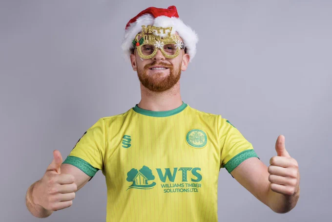Caernarfon Town’s Sion Bradley wearing Christmas accessories.