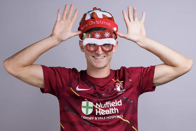 Cardiff Met’s Sam Richards wearing Christmas accessories.