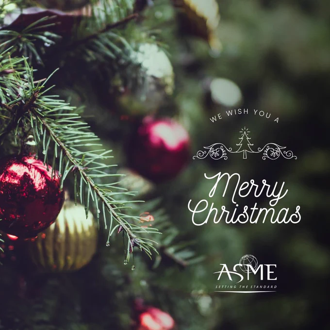 Close-up of a Christmas tree branch decorated with red baubles and a message saying "We wish you a Merry Christmas" from ASME.