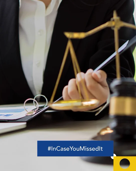 Image presenting a lawyer reflecting on documents