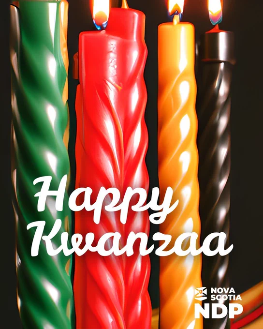 Close-up of five lit Kwanzaa candles in green, red, yellow, and black. Text reads “Happy Kwanzaa,” with an NSNDP logo.
