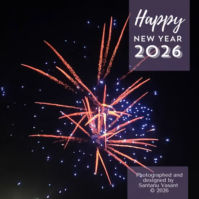 Happy New Year 2026 - Fireworks in orange and blue in the winter sky