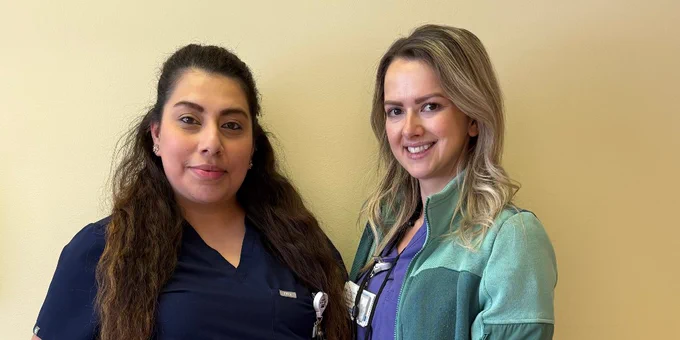Two healthcare professionals standing side by side