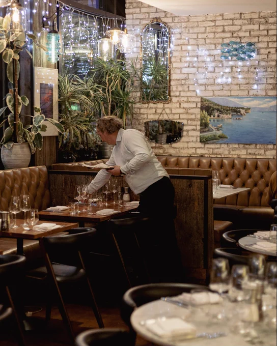 Staff working at seafood restaurant called Matthew’s Kitchen Seafood Restaurant based in Whetstone, North London. Asking followers if they still have their Christmas tree up.