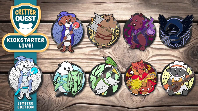 a table with lots of critter quest enamel pins on it featuring animal adventurers.