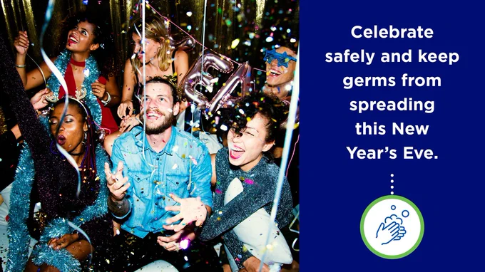 A group of young adults celebrate New Year’s Eve indoors, laughing and cheering as confetti falls around them. They wear party clothes and hold festive decorations, including number balloons. On the right side, a blue panel reads, “Celebrate safely and keep germs from spreading this New Year’s Eve,” with a handwashing icon below.