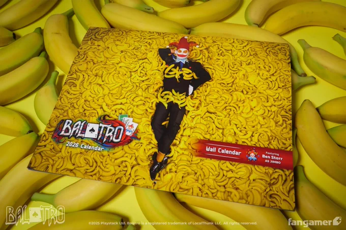 A photo of the Balatro 2026 Wall Calendar, whose cover has a photo of Ben Starr as Jimbo on a large pile of bananas, resting on a small pile of bananas. 