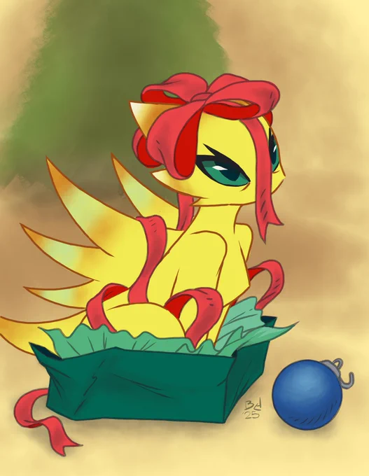 Daxie the dragon fits and sits in her Christmas box