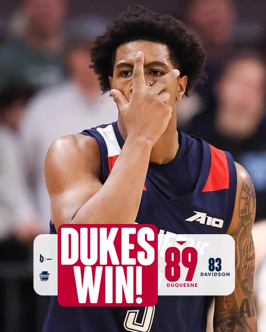 Jimmie covering face in celly. 89 duquesne. 83 Davidson. DUKES WIN!