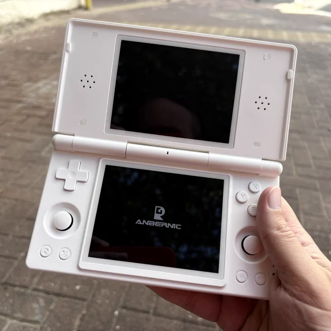 A white Anbernic RG DS.