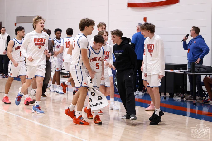 Herbert Hoover HS boys basketball teammates congratulating Landon Koepsel after his game winning shot.