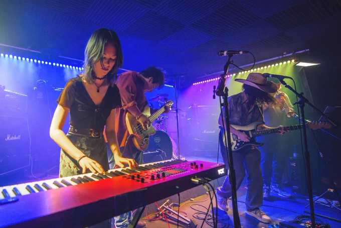 Students performing on stage.