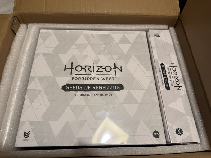 Image of an open box containing the Horizon Forbidden West, Seeds of Rebellion board game.