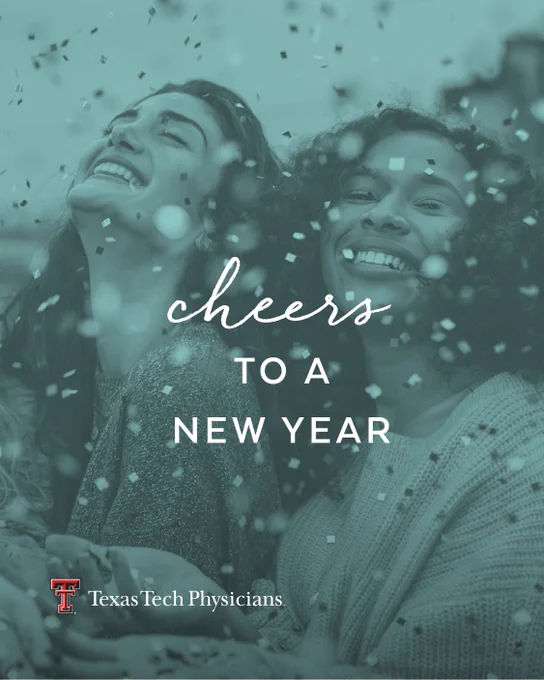 Two women smile while celebrating a new year with the words “CHEERS TO A NEW YEAR”. 