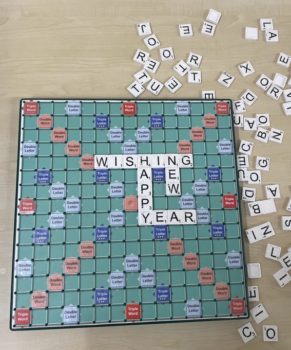Scrabble board displaying the words, WISHING, HAPPY, NEW, and YEAR. Photo taken at a Time to Unwind event at Golders Green Library.