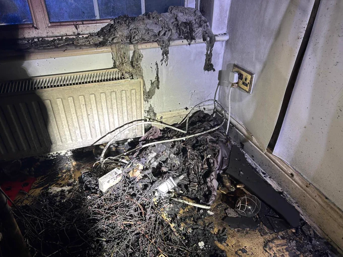 Burnt out wires in the corner of a room