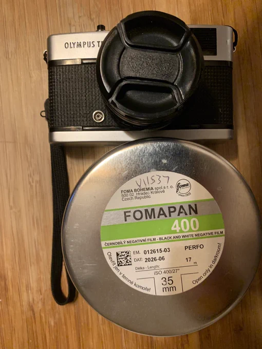Canister of Fomapan 400 film and Olympus Trip