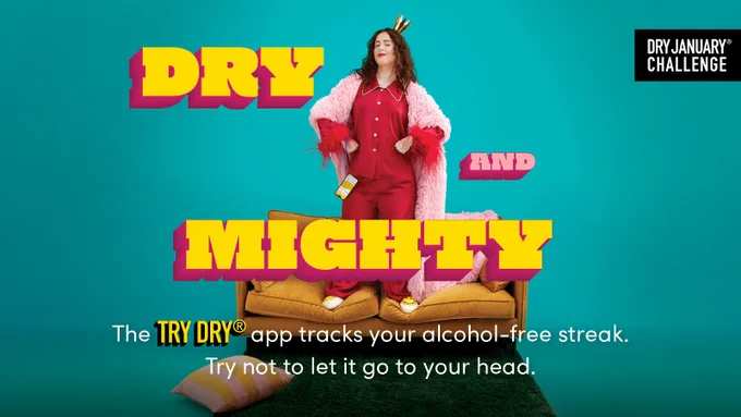 Image of a woman standing on a sofa with hands on her hips along with text: dry and mighty. The Try Dry app tracks your alcohol-free streak. Try not to let it go to your head. Dry January Challenge.