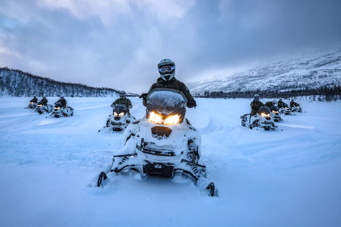Royal Marines on skidoos in the Arctic