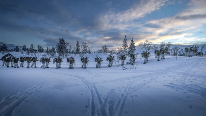 Royal Marines yomp across the Arctic terrain