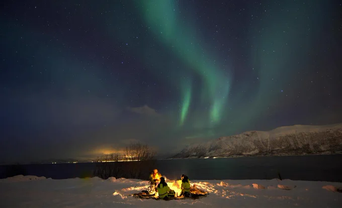 Campfire under beautiful night sky
