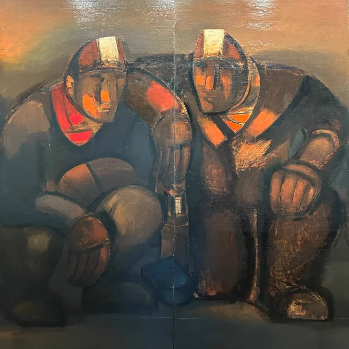 An oil painting in earthy brown colours. Two miners crouch down. They both wear helmets with a glowing lamp on the front and the miner on the right holds a lantern.