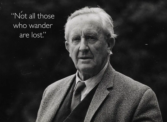 Black and white photograph of J.R.R. Tolkien with a quote overlay: 'Not all those who wander are lost.'