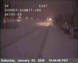 Caltrans webcam shows snow covered roads at Donner Summit on I-80.
