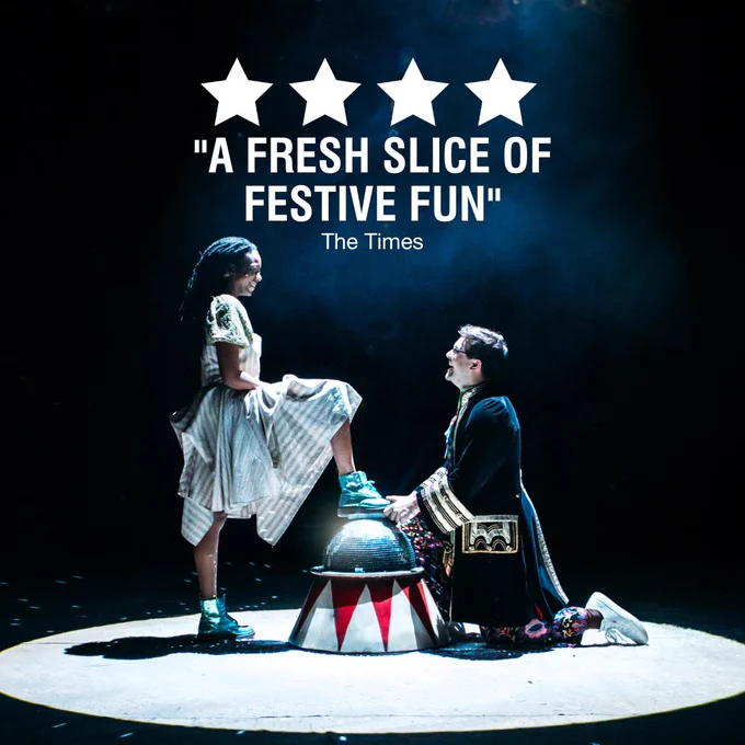 Evlyne Oyedokun and Charlie Venables on stage in Cinderella:A Fairytale. A four star review reads "A fresh slice of festive fun" - The Times