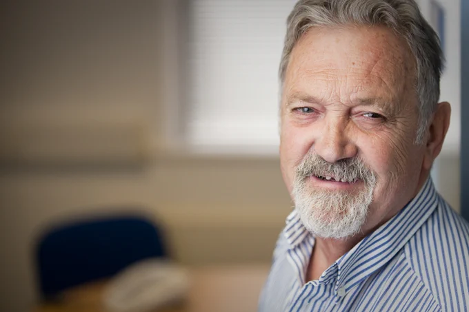 Image of Bob with him smiling and facing the camera. He is sitting in the Ruils meeting room. 