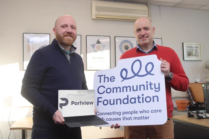 Picture (Caption L-R - John O'Doherty of the Community Foundation receives laptops from Paul Scullion, Managing Director at Portview)
