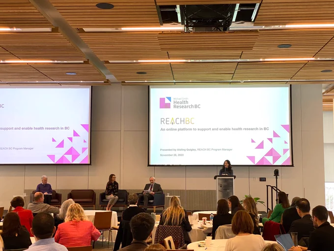 Aisling Quigley delivers a presentation on REACH BC to attendees of the symposium.