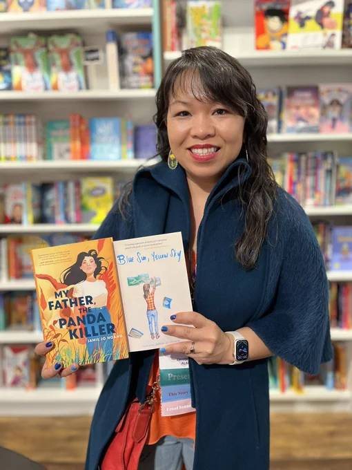 Author Jamie Jo Hoang holds her books at Cover to Cover Children’s Books.