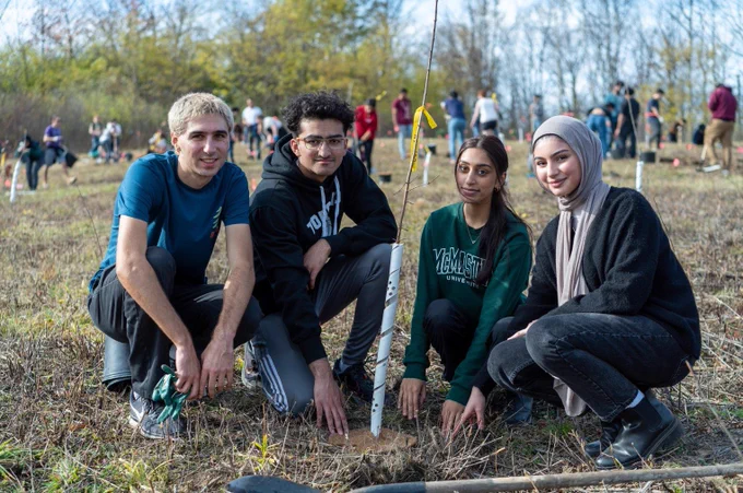 Students planting trees in Hamilton, Ontario.