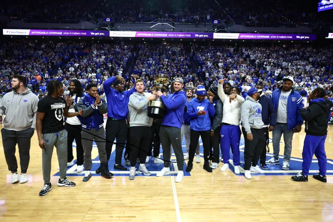 The Kentucky Football Team is honored on the court in Rupp Arena