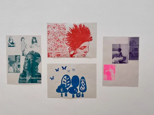 A detail from an exhibition of riso prints on white walls. Four prints are arranged with two landscape orientated ones in the middle one on top of the other and a portrait orientated print either at either side. in them you can see a mix of collaged magazine cut outs and hand drawn elements in single colours .