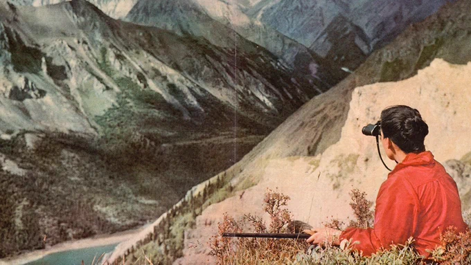 A woman looks over the Alaskan wilderness on assignment for Sports Illustrated, 1959