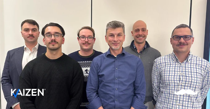 Kaizen employees with moustaches grown for Movember with Kaizen and Movember logo.