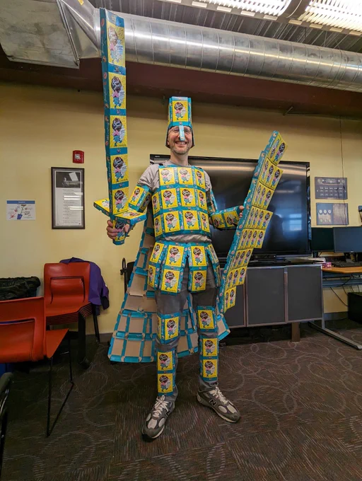 Sean in a suit of armor made out of sweet deals box tops