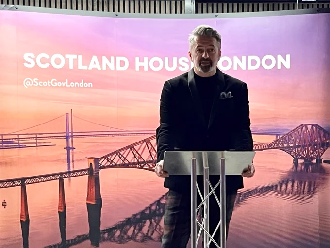 A photo of Head of Scotland House London - John Webster, delivering a welcome speech 