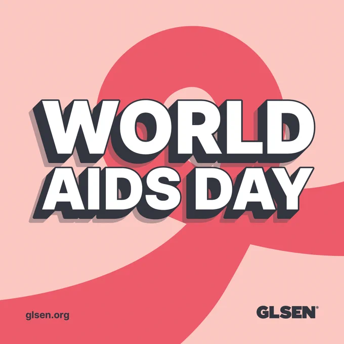 A large red ribbon on a light pink background is overlayed with the words "WORLD AIDS DAY".