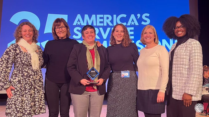 MSA employees posing with the ASC award.