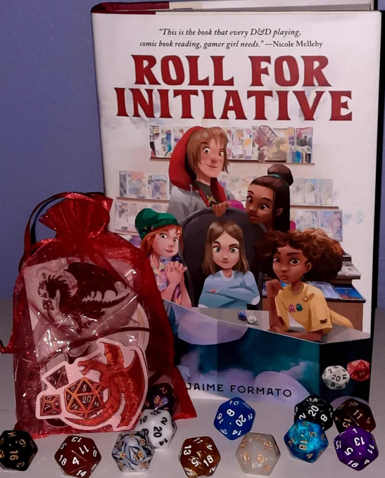 A copy of the DnD-themed book ROLL FOR INITIATIVE, multi-colored twenty-sided dice,  and a small red bag with DnD themed items.